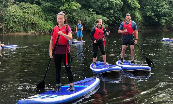 Stand-up paddleboarding on the River Wye in the Wye Valley Monmouthshire Wales for all, families, friends & team building days out.